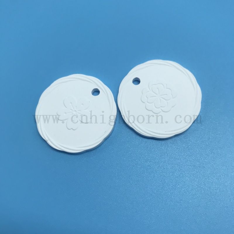 Plaque suspendue de diffuseur d'arome de pierre parfumée en céramique poreuse d'argile de logo de double côté