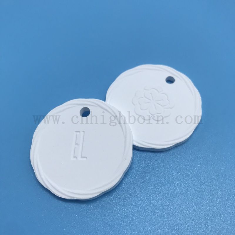 Plaque suspendue de diffuseur d'arome de pierre parfumée en céramique poreuse d'argile de logo de double côté