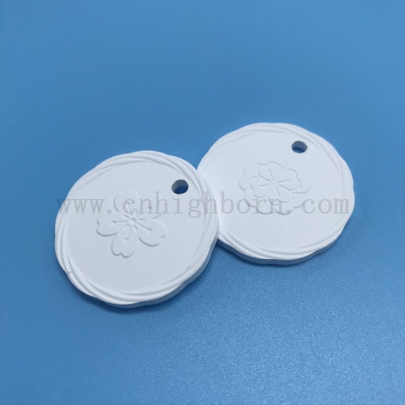 Plaque suspendue de diffuseur d'arome de pierre parfumée en céramique poreuse d'argile de logo de double côté